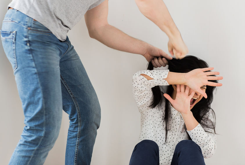 unhappy woman suffering from domestic violence